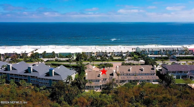 aerial view featuring a view of the beach and a water view