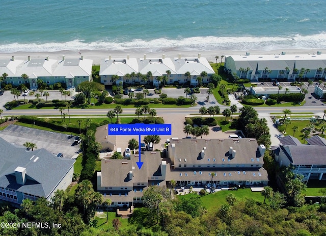 aerial view featuring a water view and a beach view