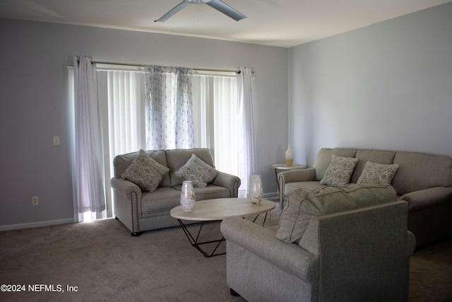 carpeted living room with ceiling fan