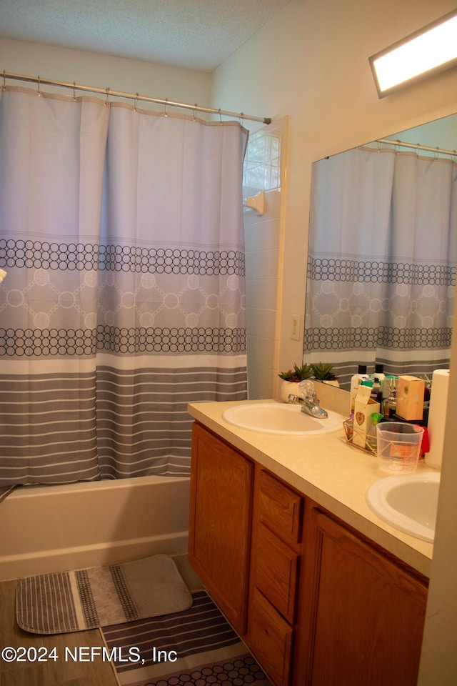 bathroom with vanity and shower / tub combo with curtain