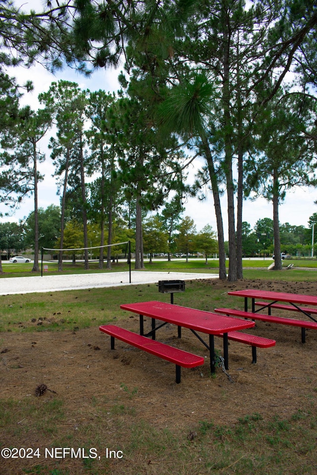 view of property's community featuring volleyball court