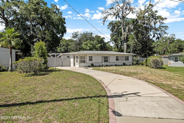 ranch-style house with a front lawn