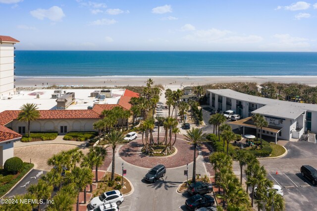 aerial view featuring a view of the beach and a water view