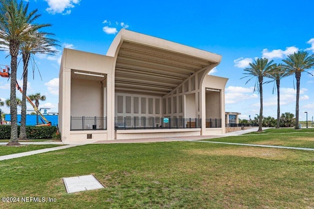 exterior space featuring a lawn and stucco siding