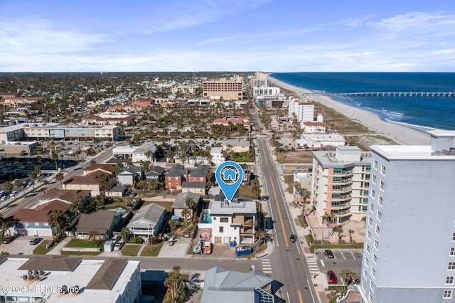 aerial view featuring a view of the beach and a water view