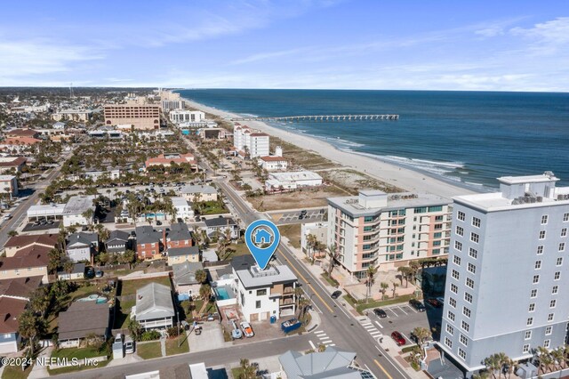 aerial view featuring a view of the beach and a water view