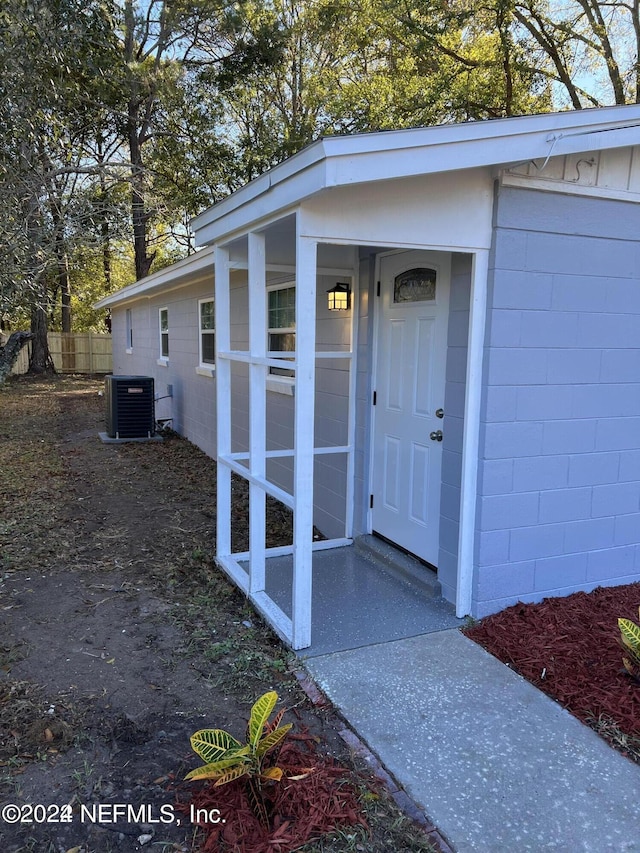 doorway to property featuring central AC