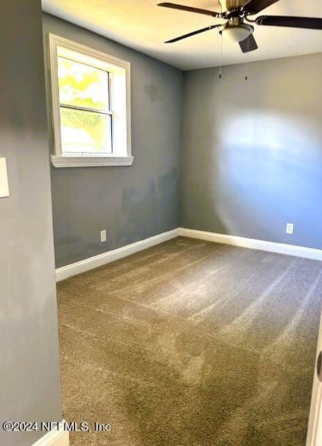 carpeted empty room with ceiling fan