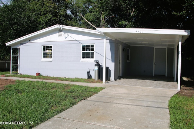 view of front of property with a carport