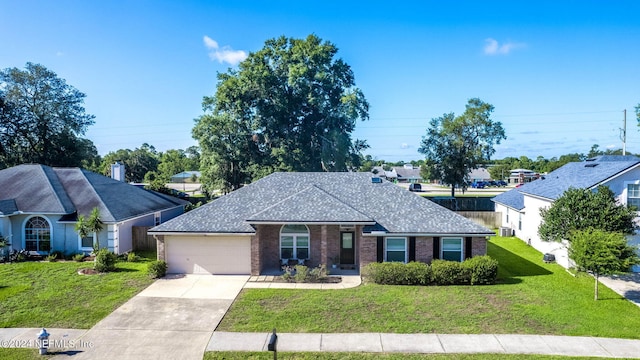 single story home with a front yard and a garage