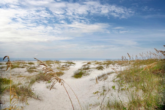 property view of water featuring a beach view