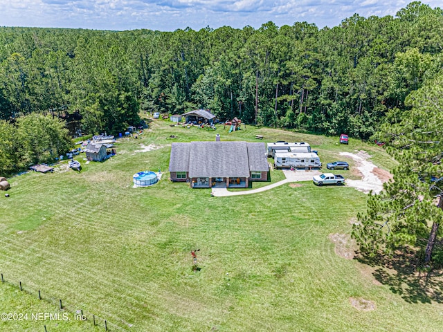 aerial view with a wooded view