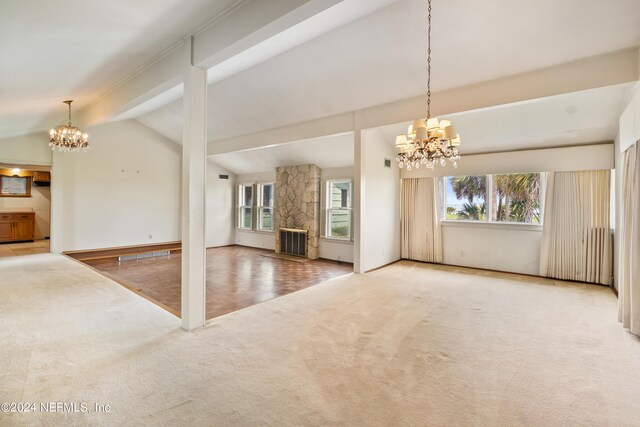 unfurnished living room featuring vaulted ceiling with beams, radiator, carpet, and an inviting chandelier