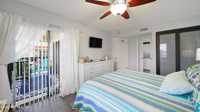 tiled bedroom with access to exterior and ceiling fan