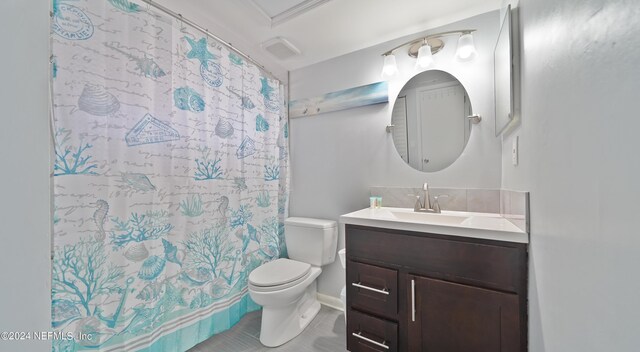 bathroom featuring tile patterned floors, vanity, curtained shower, and toilet