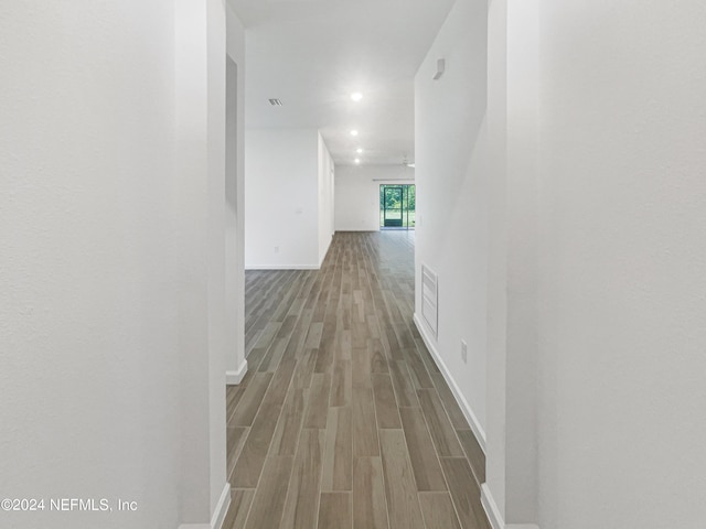 hallway with light wood-type flooring