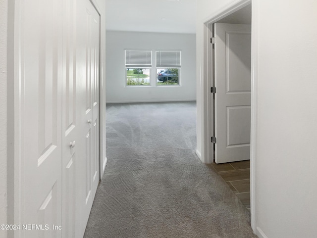 corridor with carpet flooring