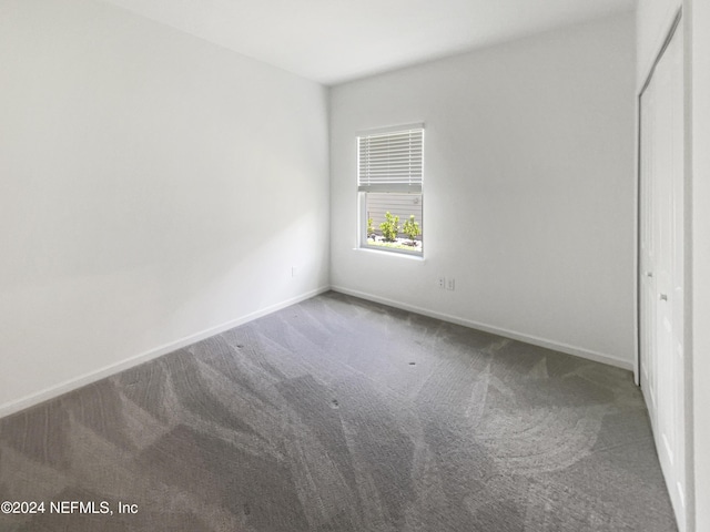 unfurnished bedroom with carpet flooring