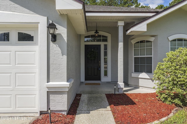 entrance to property featuring covered porch