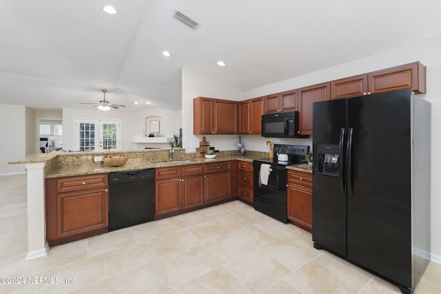 kitchen featuring ceiling fan, french doors, light stone counters, kitchen peninsula, and black appliances