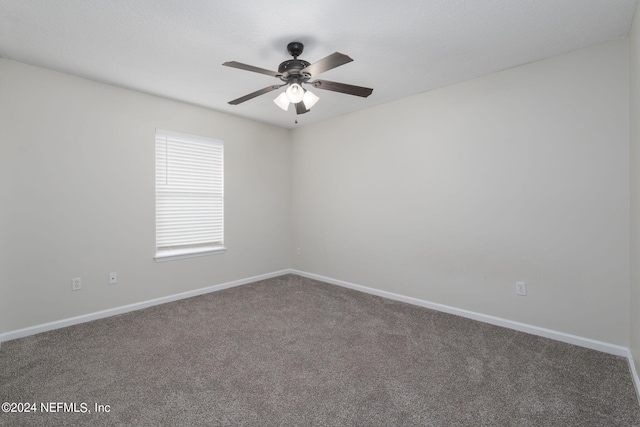 unfurnished room featuring carpet and ceiling fan