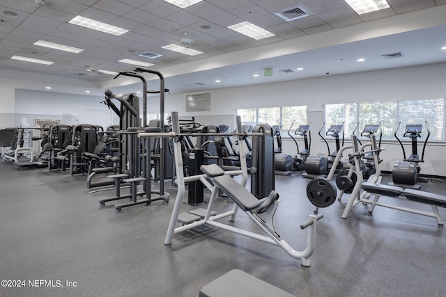 workout area featuring a paneled ceiling