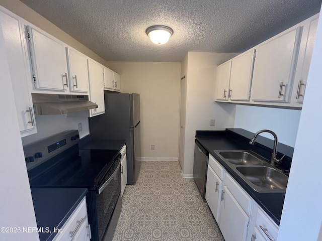 kitchen with sink, a textured ceiling, light tile patterned floors, stainless steel appliances, and white cabinets