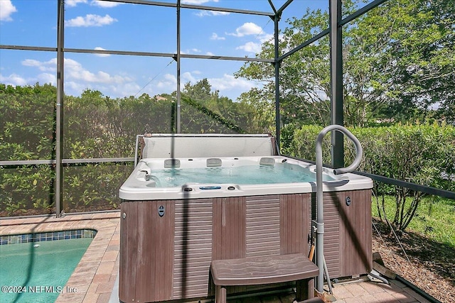 sunroom / solarium with a hot tub