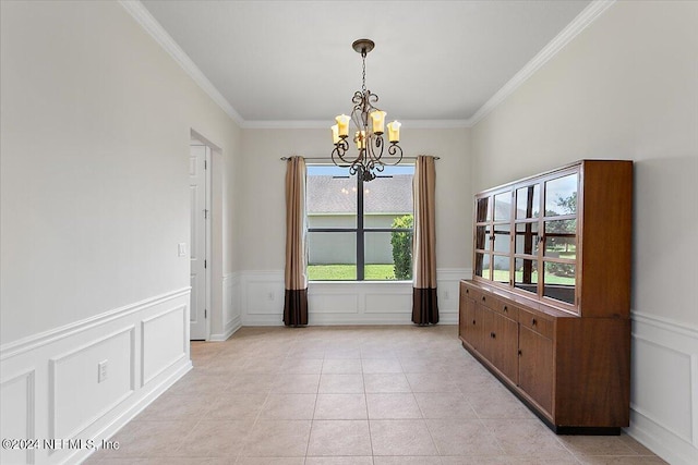 unfurnished dining area featuring light tile patterned floors, an inviting chandelier, and crown molding