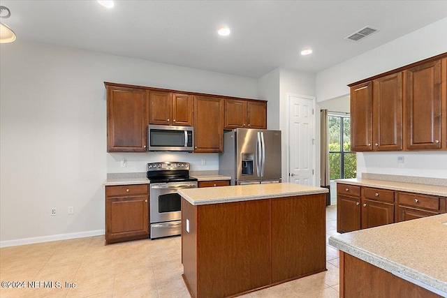 kitchen with a center island and appliances with stainless steel finishes