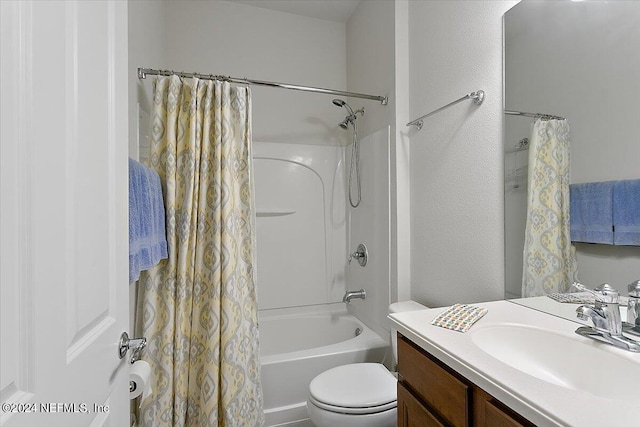 full bathroom with shower / bath combination with curtain, vanity, and toilet