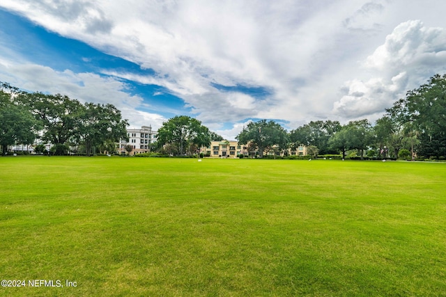 view of home's community featuring a lawn