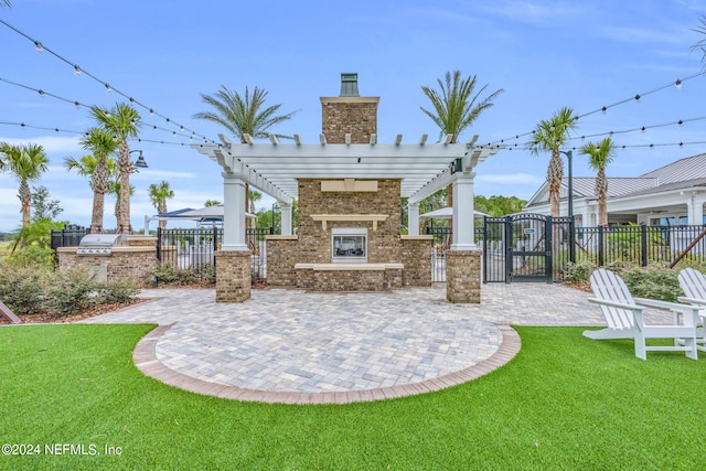 view of patio featuring a pergola and an outdoor kitchen