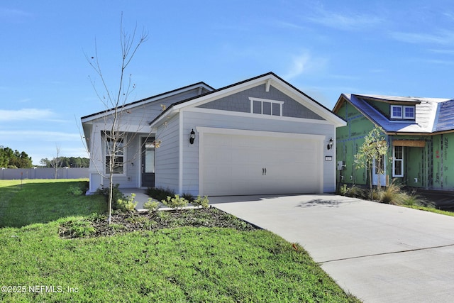 view of front facade featuring a front lawn and a garage