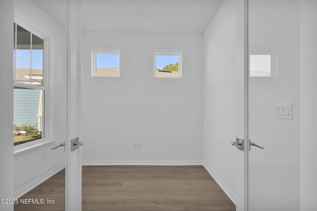 spare room with hardwood / wood-style floors