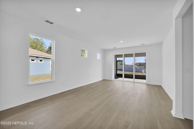 spare room with light wood-type flooring