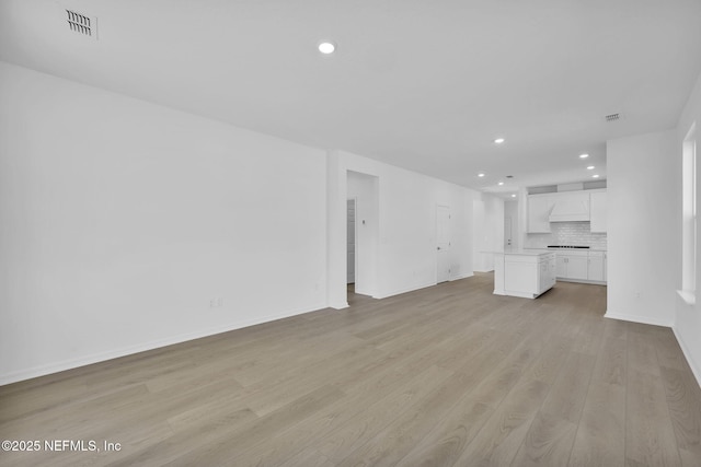 unfurnished living room featuring light wood-type flooring