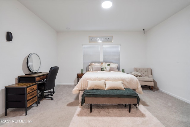 bedroom with light carpet