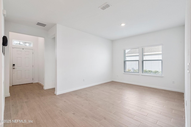 unfurnished room with light hardwood / wood-style floors