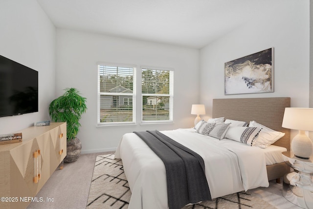 bedroom featuring light carpet