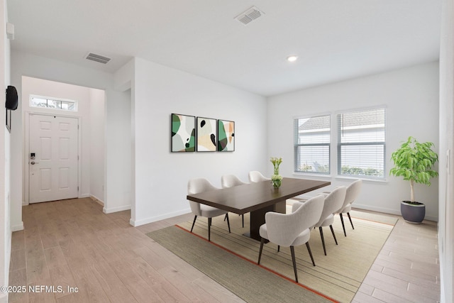 dining space featuring light hardwood / wood-style floors