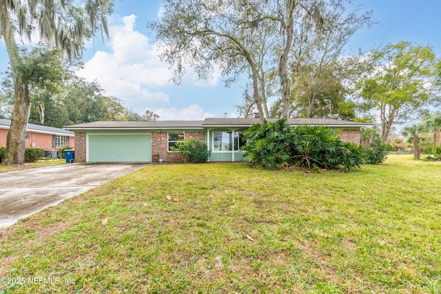 ranch-style home featuring a garage and a front lawn