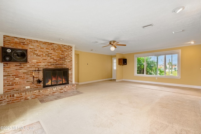 unfurnished living room featuring a fireplace, a textured ceiling, and ceiling fan