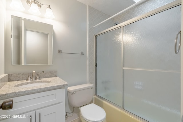 full bathroom featuring vanity, toilet, and enclosed tub / shower combo