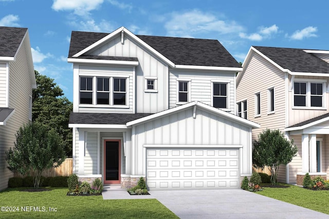 view of front facade with a garage and a front yard