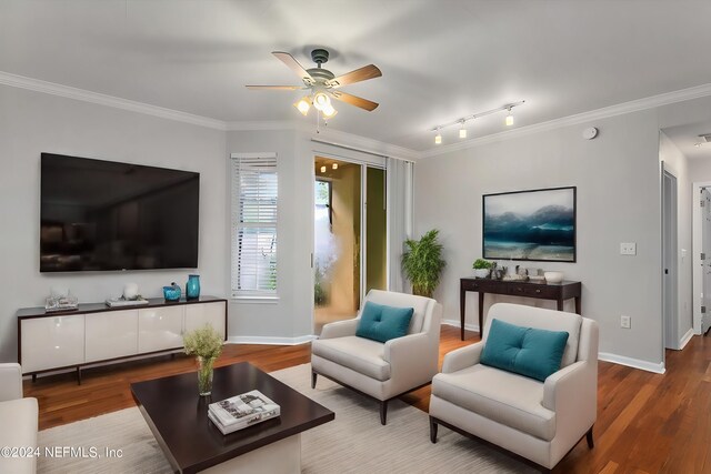 living room featuring ceiling fan, hardwood / wood-style floors, crown molding, and track lighting