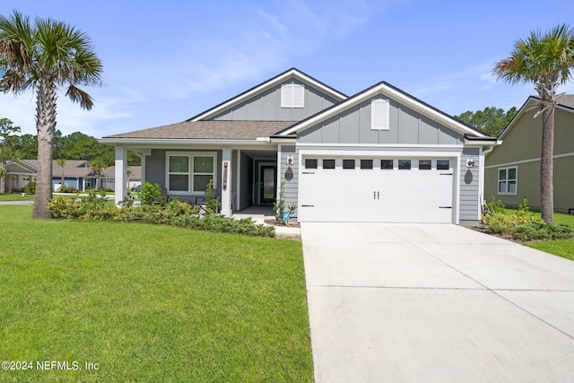 view of front of house with a garage and a front lawn