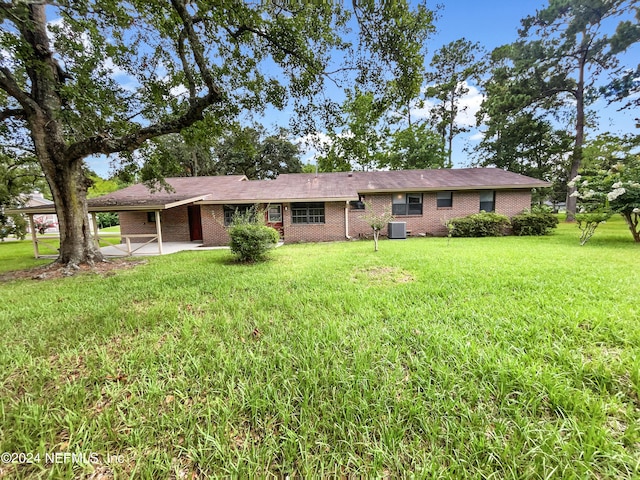 ranch-style house featuring a patio, central AC, and a front lawn