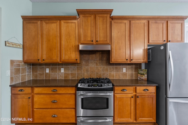 kitchen with backsplash, dark stone counters, and appliances with stainless steel finishes