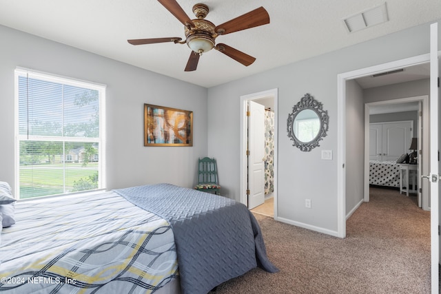 carpeted bedroom with ceiling fan